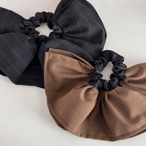 Two-piece set of large striped bow scrunchies in classic black and brown fabric