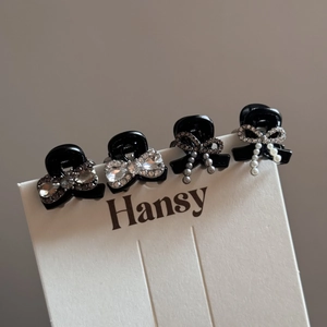 Elegant four-piece black mini hair claw clip set with pearls, rhinestones and bows