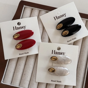 Oval acetate hair clips in burgundy, black and white marble with gold metal Korea labels