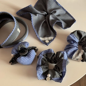 Detail of sweet blue plaid and grey denim scrunchie set with lace and pearl accents