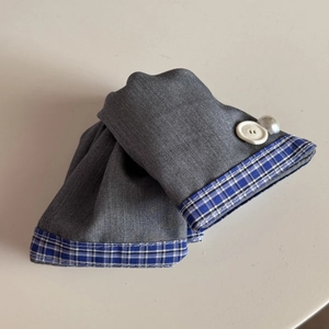 Detail of sweet grey twill hair scrunchie with blue plaid trim and pearl button accent