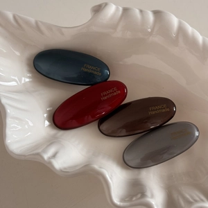 Set of four elegant oval hair clips in dark blue, burgundy, coffee, and grey resin finish