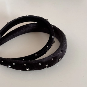 Elegant black velvet headband set with sparkling rhinestones for a retro vintage style