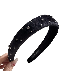 Elegant black velvet headband with sparkling rhinestones and handmade inner label detail
