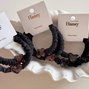 Three-piece set of black pleated scrunchies with chic leopard heart and clover charms