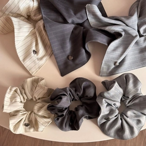 Three-piece striped fabric scrunchie and bow set with elegant silver heart charms
