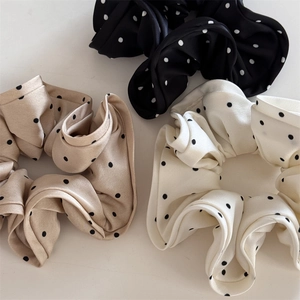 Three-piece polka dot satin scrunchie set in black, champagne gold, and white colors