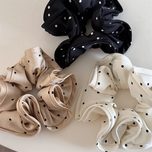 Polka dot satin scrunchies set in black, champagne and white for elegant hairstyles