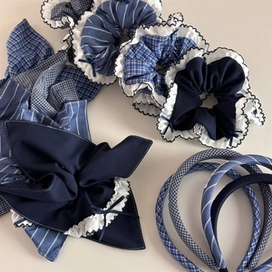 Blue plaid scrunchie set with ribbon bows and fabric headbands for hair styling