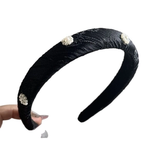 Elegant black jacquard headband with white pearl flower clusters and vintage satin texture