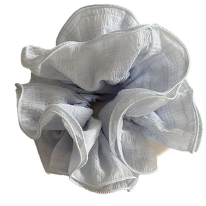 Oversized light blue scrunchie with ruffled texture for high-end hairstyling
