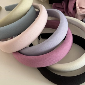 Macro shot showing ribbed texture detail of colorful padded sponge headbands for women