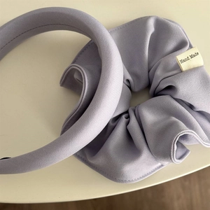 Detail of lavender padded sponge headband and matching textured fabric scrunchie set