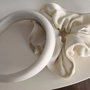 Detail of cream white sponge headband and matching handmade scrunchie in twill fabric