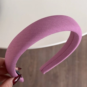 Detailed view of the rose pink padded sponge headband with premium ribbed knit fabric texture