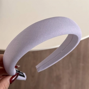 Close-up of light purple sponge headband featuring fine ribbed knit texture and soft volume