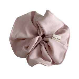 Pink oversized fabric scrunchie with Hand Made label for stylish hair styling