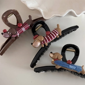 Detailed close-up of cute dachshund hair claws in brown and black with fabric textures