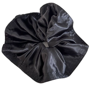 Elegant large black silk satin hair scrunchie with oversized ruffles and shiny texture