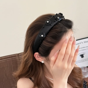 Elegant black sequin headband with rhinestone fabric flowers for a stylish high crown look