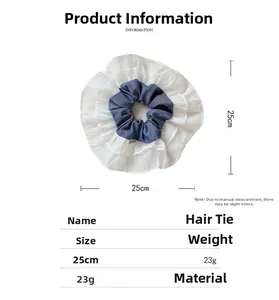 Detail view of contrast color hair scrunchie with 25cm diameter and mesh fabric layers