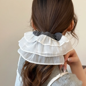 Elegant oversized white tulle scrunchie with layered lace ruffles and a grey cotton bow