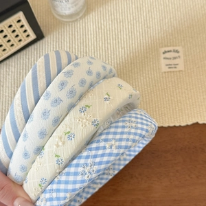 Set of four blue and white striped fabric headbands in a stylish minimalist design