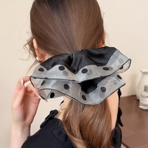 Elegant polka dot mesh hair scrunchie shown on a ponytail with satin and organza