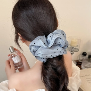 Elegant light blue polka dot mesh scrunchie hair accessory for buns and ponytails