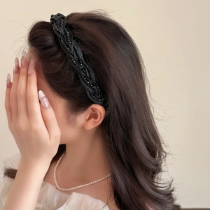 Braided black beaded headband for women with elegant wide twisted design and glossy beads