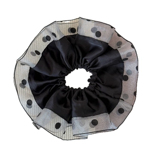 Luxurious mesh polka dot scrunchie with satin inner ring for elegant ponytails