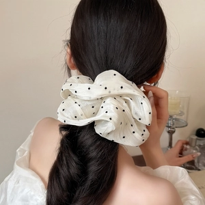 Elegant cream white scrunchie with black polka dots on mesh fabric for ponytails