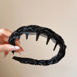 Close-up of black beaded braided headband featuring woven chiffon and anti-slip inner teeth