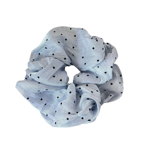 Elegant light blue mesh scrunchie with black polka dots for stylish hair styling