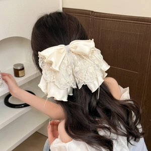 Elegant cream layered lace bow hair claw clip with pearl accents for women