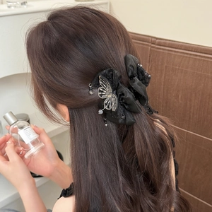 Pince à cheveux papillon en dentelle noire avec strass argentés pour femmes