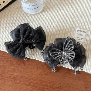 Pinces à cheveux papillon en maille noire élégantes avec strass pour un look chic raffiné
