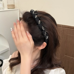 Elegant black pleated headband with sparkling crystals for high cranial top hairstyle