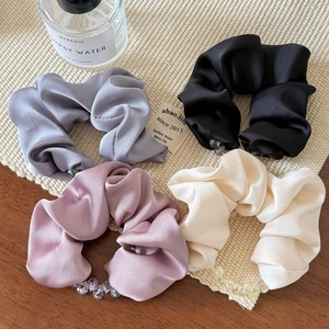 Elegant 4-piece satin hair scrunchies set with beads in assorted colors on wooden table
