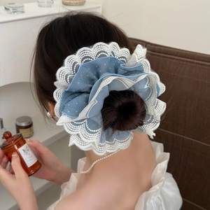 Blue polka dot mesh scrunchie with white lace embroidery for elegant buns