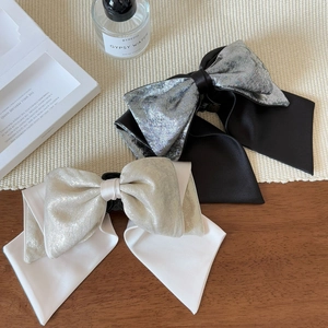 Elegant satin bow hair claw clip in black and silver colors for women's hairstyle
