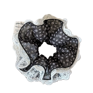 Elegant four-layer lace scrunchie in black floral paisley fabric with white embroidery