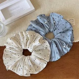 Set of two pleated polka dot scrunchies with white pearls in blue-grey and cream white