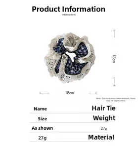 Close-up of checkered fabric hair scrunchie with lace trim, size 18cm x 18cm detail