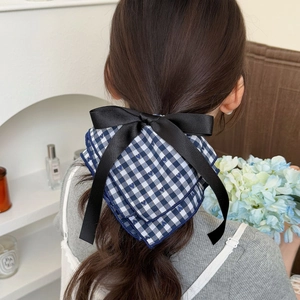 Elegant large bow hair scrunchie with blue checkered fabric and black satin ribbon detail