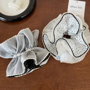 Elegant mesh scrunchies set with lace trim in blue and white polka dot design