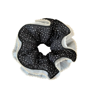 Minimalist black polka dot scrunchie with cream lace trim and pleated mesh fabric
