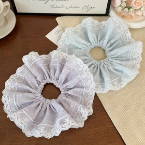 Elegant set of purple and light blue lace scrunchies with delicate floral patterns