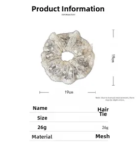 Detailed view of large white lace scrunchie with floral embroidery and 19cm diameter size