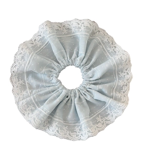 Sweet light blue polka dot scrunchie with white lace trim for elegant ponytail styling
